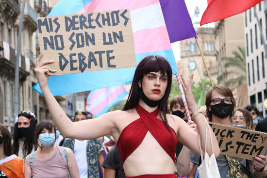 A person holding up a sign at a LGBTI rights protest in Barcelona (by Eli Don)